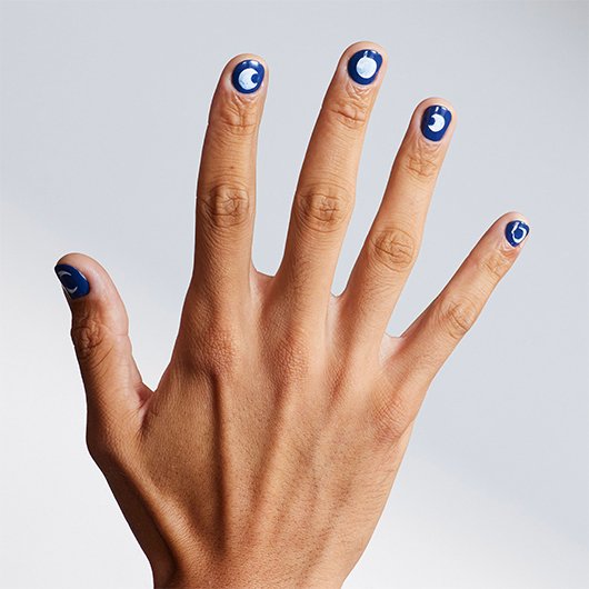 outstretched medium skin hand with short nails, each featuring werewolf nail art with different moon cycles on a blue base