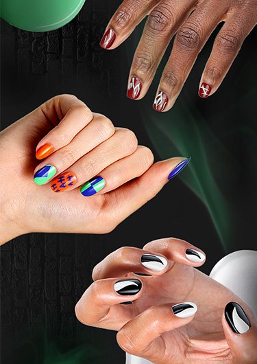 halloween-themed background with three hands featuring different halloween nail art designs