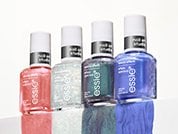 four shades of essie nail polishes in a row with swatches running off the ledge below